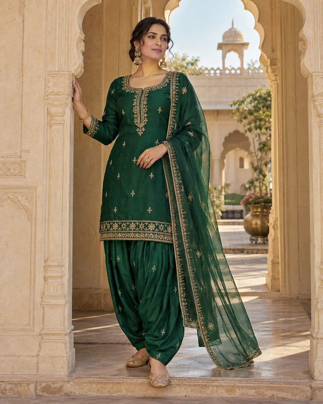 Festive Punjabi suit inspiration in emerald green with gold embroidery and a sheer dupatta